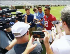  ?? BUTCH DILL — THE ASSOCIATED PRESS ?? Alabama quarterbac­k Jalen Hurts (2) speaks to media before a NCAA college football practice, Saturday in Tuscaloosa, Ala.