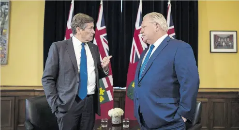  ?? TIJANA MARTIN / THE CANADIAN PRESS ?? Toronto Mayor John Tory and Ontario Premier Doug Ford meet inside the Premier’s office at Queen’s Park in Toronto earlier this month. The Ontario government has moved to reduce Toronto city council to about half its current size.