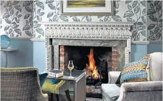  ?? ?? i Cosy up by the fire: enjoy an indulgent stay at the 17th-century Lainston House