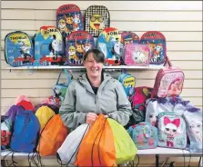  ?? ?? Group co-ordinator Amanda Duffy Brown surrounded by the first batch of children’s backpacks heading over to Ukraine.