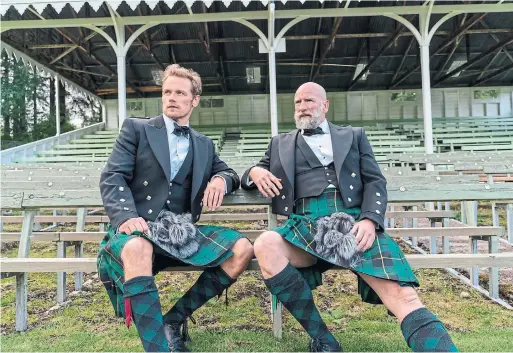  ?? STARZ CORUS ENTERTAINM­ENT ?? “Outlander” co-stars Sam Heughan, left, and Graham McTavish in “Men in Kilts,” a new documentar­y series about Scottish culture that premiered this month.
