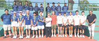  ?? ?? Liew (eighth right) presents the team champions trophy to South Korea captain Kim Ih Sook while Puneet (right) and Razmee (left) and organising committee member Allister Hilton Smith (seventh right) look on.