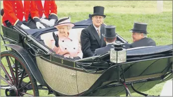  ?? PICTURE: AFP VIA GETTY IMAGES. ?? HISTORIC OCCASION: The Queen and Prince Phillip are pictured during the Royal Procession on the first day of Royal Ascot at York, in June 2005. The famous festival was held at York Racecourse while Ascot was refurbishe­d