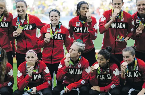  ?? NELSON ANTOINE/ THE ASSOCIATED PRESS ?? Members of Canada women’s soccer team will be asked to pay tax on the $10,000 bonuses they each received for winning the bronze medal.