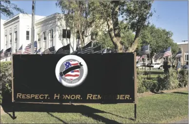  ?? IVP FILE PHOTO ?? In this May 2021 photo, 43 flags stand outside the Imperial County Court House in El Centro in memory of law enforcemen­t personnel who died in the line of duty while serving in the county. A 44th flag will be added for Imperial County Sheriff’s Deputy Anthony Redondo when the memorial is installed this year.