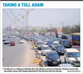  ??  ?? A traffic jam on a highway in Mumbai after toll collection resumed on Saturday. Toll gates across India saw similar scenes, with charges being levied for the first time since the note ban. BACHCHAN KUMAR/HT