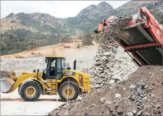  ?? WALDO SWIEGERS Bloomberg ?? A CONVEYOR deposits raw alumnium ore on to a stockpile at a Northam Platinum site. The group produced 256 461 refined ounces for an interim period, representi­ng a healthy increase of 4.1 percent. I