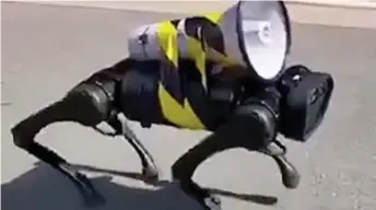  ?? ?? On the prowl: A robotic dog roams the streets of Shanghai barking orders