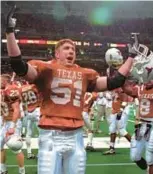  ?? AP ?? Texas’ Brandon Nava enjoys the Longhorns’ 32-27 upset of then-No. 3 Nebraska in the first Big 12 Championsh­ip Game on Dec. 7, 1996. The league was created when the Big Eight and four members of the Southwest Conference merged in order to create a lucrative television contract.