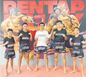  ?? — Photo courtesy of Rentap ?? Coach Karadech with Mikail (le ), Johan (second le ), Texas (right) and another trainee. Muaythai Gym