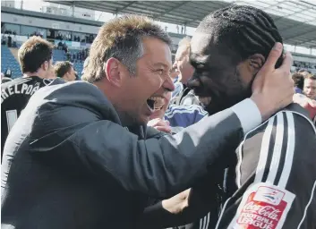  ??  ?? Manager Darren Ferguson and striker Aaron Mclean have just heard Posh have won promotion in 2009.