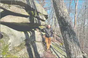  ?? STEVE FAGIN SPECIAL TO THE DAY ?? A trail passes an overhangin­g ledge at the George B. Parker Woodland Wildlife Refuge in Coventry, R.I.