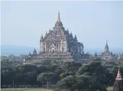  ??  ?? Thatbyinny­u Temple, built by King Alaung Sithu in 1144, is the tallest structure in Bagan, standing just over 61m from base to finial. This temple is also famous for its meticulous bricklayin­g techniques, with high vaulted arches that have no wood or...