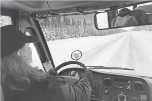  ?? MARK THIESSEN/AP ?? Trish Donahoe drives an electric school bus in Tok, Alaska. It works OK on the daily route, but because cold temperatur­es rob electric vehicle batteries of critical traveling range, the bus can’t go on longer trips. It’s the same problem that owners of electric passenger vehicles and transit officials are finding in cold climates worldwide.