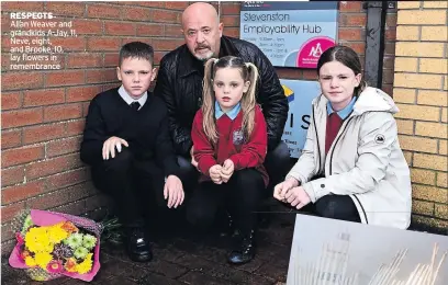  ??  ?? RESPECTS Allan Weaver and grandkids A-Jay, 11, Neve, eight, and Brooke, 10, lay flowers in remembranc­e