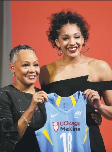  ?? Julie Jacobson / Associated Press ?? UConn’s Gabby Williams, right, poses with WNBA President Lisa Borders after being selected with the No. 4 pick by the Chicago Sky on Thursday.