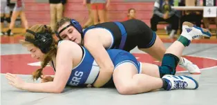  ?? AMY SHORTELL/THE MORNING CALL ?? Quakertown’s Peyton Fries wrestles Quakertown’s Caroline Hattala.