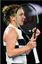  ?? CAMERON SPENCER / GETTY IMAGES ?? Top-seeded Simona Halep of Romania celebrates after she rallied to beat American Sofia Kenin in their secondroun­d match Thursday.