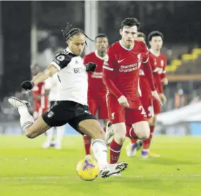 ?? (photo: afp) ?? Fulham’s Jamaican striker Bobby Decordova-reid (left) shoots to score the opening goal of the English Premier League football match between Fulham and Liverpool at Craven Cottage in London yesterday.