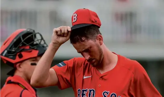  ?? GERALD HERBERT/ASSOCIATED PRESS ?? Red Sox starter Cooper Criswell had 1-2-3 innings in the first and second before running into trouble in the third.