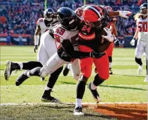  ?? GREGORY SHAMUS / GETTY IMAGES ?? Browns running back Nick Chubb shakes off Falcons linebacker De’Vondre Campbell and runs in for a touchdown Sunday at FirstEnerg­y Stadium in Cleveland.