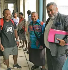  ?? Photo: Ashna Kumar ?? Lawyer Nemani Tuifagalel­e (right) with the residents and evicted families of Tamavua-i-Wai settlement outside the Civil High Court in Suva on February 5, 2020.