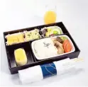  ?? ?? A COMPLETE PACKAGE Flying on premium economy class allows passengers to enjoy perks such as an amenity kit (above) and a Japanese meal (below)