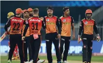  ??  ?? SRH squad celebrates a dismissal during match 52 of IPL 2020 at Sharjah Cricket Stadium, in Sharjah on Saturday. (ANI Photo)