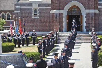  ?? STAFF PHOTOS BY PATRICK WHITTEMORE ?? IN HIS HONOR: Firefighte­rs, above, and parents Mark Poitras and Miriam Nieves Poitras, both below, leave St. Rita church after the funeral Mass for Justin Poitras, left, yesterday.