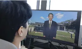  ?? AP PHOTO ?? AI VIDEO REVIVAL
Lee Geon Hui looks at a computer screen as a video clip shows a digital likeness of his late grandfathe­r speaking at Seoul-based tech firm Vaice, South Korea, on June 12, 2026.