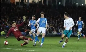  ?? Williamson/AMA/Getty Images ?? Jack Grealish scores Manchester City’s second goal at Peterborou­gh. Photograph: James