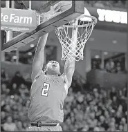  ?? AP/BRAD TOLLEFSON ?? Texas Tech’s Zhaire Smith (2) has a slam dunk in No. 8 Texas Tech’s 72-71 victory over No. 2 West Virginia on Saturday in Lubbock, Texas.