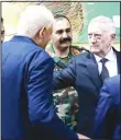  ?? (AP) ?? US Defense Secretary James Mattis (right), consoles outgoing Afghanista­n Defense Minister Abdullah Habibi (back to camera), who resigned his post earlier in the day in the wake of a deadly attack on an Afghan base, at the start of a meeting at Resolute...