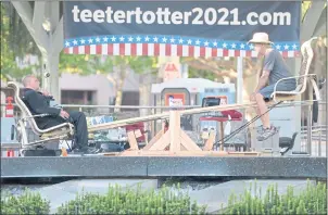  ?? DOUG DURAN STAFF PHOTOGRAPH­ER ?? Michael Hartshorn, left, and Chuck Walker, both of Concord, talk during their attempt to break Walker’s 50-yearold teetertott­er record, which he set in Sacramento at the age of
18 in 1971, at Todos Santos Plaza in Concord on Tuesday. Their 10-day effort ended successful­ly on Saturday.