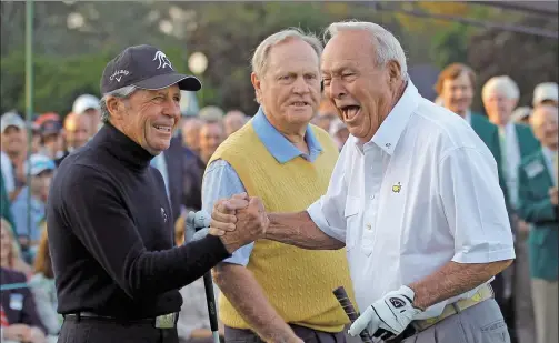  ?? BRIAN SNYDER / REUTERS FILE ?? Honorary starter Arnold Palmer (right) is congratula­ted by fellow golf greats Gary Player (left) and Jack Nicklaus after hitting his drive during the ceremonial tee-off before first-round play in the 2012 Masters at the Augusta National Golf Club in...