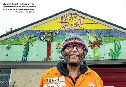  ?? WARWICK SMITH/STUFF ?? Michael Angelo in front of his Palmerston North mural, which took five months to complete.