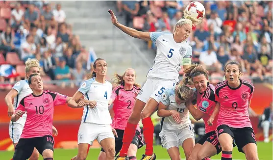  ?? Pictures: Getty/PA. ?? England’s Steph Houghton clears the ball during a Scotland attack.