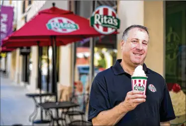  ?? RICHARD GRAULICH / THE PALM BEACH POST ?? Owner Ken Weiner stands outside his Rita’s Italian Ice location on Rosemary Avenue in CityPlace in West Palm Beach. His other site is at Southern Palm Crossing in Royal Palm Beach. “It is a lot of labor,” he said.