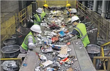  ?? Carolyn Cole Los Angeles Times ?? LANCASTER WILL expedite Solena Group’s permitting process and send the company its paper recyclable­s, rather than paying to dump them in a landfill. Above, a recycling center in Burbank last year.