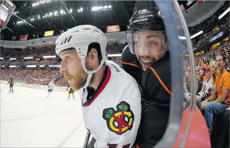  ?? — PHOTOS: THE ASSOCIATED PRESS FILES ?? Anaheim Ducks winger Emerson Etem, right, and Chicago Blackhawks centre Andrew Desjardins battle during Game 1 of the Western Conference final Sunday. The Ducks won 4-1. With the New York Rangers and Tampa Bay Lightning battling in the Eastern final,...