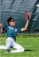  ?? ?? Shenendeho­wa center fielder Amaar Bhusri makes a sliding catch vs. Saratoga Springs on Friday at Shen.