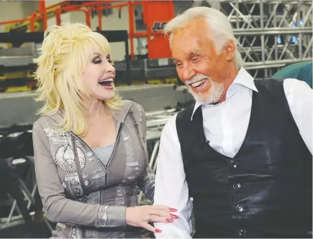  ?? RICK DIAMOND/GETTY IMAGES ?? “She’s one of those rare people that if she walked in the door and I hadn’t seen her in five years, it would be like we were together yesterday,” Kenny Rogers once said of his dear friend and fellow country music legend Dolly Parton. Rogers died last week at age 81.