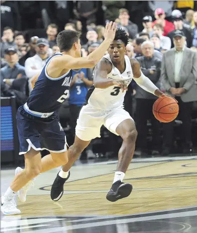  ?? File photo ?? David Duke (3) and Providence suffered an 85-67 Big East road defeat to reigning national champion Villanova Wednesday night. The Friars return to the Dunkin’ Donuts Center Saturday afternoon to face Xavier.