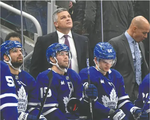  ?? DAN HAMILTON / USA TODAY SPORTS FILES ?? Even though Leafs head coach Sheldon Keefe has the best record after 205 regular-season games of any coach in franchise history, he’s still a bit of a mystery, Steve Simmons writes. Like his team, we’re uncertain about what’s ahead.