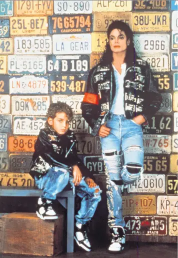  ??  ?? Wade Robson with Michael Jackson in an advert for LA Gear in 1990. Far left: Leaving Neverland director Dan Reed, centre, with Robson, left, and James Safechuck