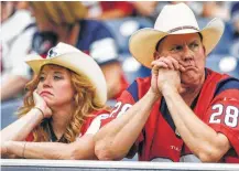  ?? Michael Ciaglo / Houston Chronicle ?? Although the Texans’ play in Sunday’s loss gave Pamela and Thomas Irby little reason to smile, fans struggling in the aftermath of Hurricane Harvey welcomed football’s return to Houston.