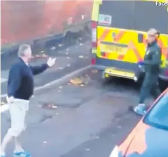  ??  ?? Van driver is filmed swearing at paramedic whose ambulance is parked in the street