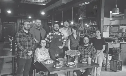  ?? DOUG HOOD/ASBURY PARK PRESS ?? The staff of Capitoline in Asbury Park, from left to right, Justin Franco, manager; Mike Peterson, manager; Lauren Guest, head server; Sergio Casal, head of food and beverage; Simon Dick, manager; Jennifer Runfola, head bartender; Charles Interrante, owner; and Megan August, kitchen manager.