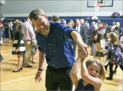  ?? EMILY OVERDORF — FOR DIGITAL FIRST MEDIA ?? Dads and daughters hit the dance floor during last week’s Father Daughter Dance held at Pottstown Middle School.