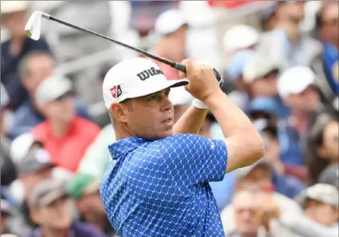  ?? Harry How/Getty Images ?? Gary Woodland continued to lead the U.S. Open, shooting a 2-under 69 to lead Justin Rose by a shot after the third round of the U.S. Open at Pebble Beach.